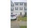 Townhome exterior featuring a driveway, garage, and well-maintained lawn at 904 Romeria Dr, Durham, NC 27713