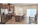 Modern kitchen boasts stainless steel appliances, granite countertops, and an island with bar seating at 904 Romeria Dr, Durham, NC 27713