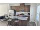 Modern kitchen featuring stainless steel appliances, island with seating, and ample cabinet space at 904 Romeria Dr, Durham, NC 27713