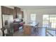 Well-equipped kitchen with stainless steel appliances, island with bar stools, and lots of light at 904 Romeria Dr, Durham, NC 27713