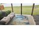 Covered patio provides a comfortable outdoor space to relax on a couch with custom cushions at 904 Romeria Dr, Durham, NC 27713