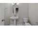 Powder room with pedestal sink and elongated toilet at 986 Gateway Commons Cir, Wake Forest, NC 27587