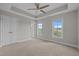 Bedroom features neutral colors, carpet, and plenty of natural light from two large windows at 986 Gateway Commons Cir, Wake Forest, NC 27587