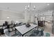 Open-concept dining room with modern chandelier and adjacent kitchen at 986 Gateway Commons Cir, Wake Forest, NC 27587