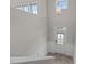 Entryway featuring a transom window above the front door, paneled walls, and decorative light fixture at 986 Gateway Commons Cir, Wake Forest, NC 27587