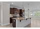 Well-appointed kitchen featuring a large center island with pendant lights and stainless appliances at 986 Gateway Commons Cir, Wake Forest, NC 27587