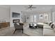 Stylish living room featuring a fireplace, shiplap accent wall, and comfortable seating at 986 Gateway Commons Cir, Wake Forest, NC 27587