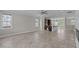 Bright living space connects to kitchen featuring stainless steel appliances and breakfast bar at 986 Gateway Commons Cir, Wake Forest, NC 27587