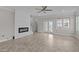 Spacious living room features a modern fireplace, ceiling fan and access to outdoor patio at 986 Gateway Commons Cir, Wake Forest, NC 27587
