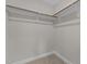 An empty walk-in closet showing a rod for hanging clothing at 986 Gateway Commons Cir, Wake Forest, NC 27587