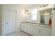Bathroom featuring double vanity with granite countertop and a walk-in shower at 1009 Morrison Dr, Durham, NC 27703