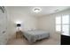 Light and airy bedroom with neutral walls and a window allowing natural light at 1009 Morrison Dr, Durham, NC 27703