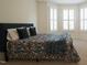 Cozy bedroom with natural light, a large bed, and plush pillows at 1009 Morrison Dr, Durham, NC 27703