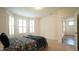 Bright bedroom featuring bay windows, plush bedding, and a serene atmosphere at 1009 Morrison Dr, Durham, NC 27703