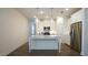 Kitchen area with a kitchen island, stainless steel appliances and granite countertops with white cabinets at 1009 Morrison Dr, Durham, NC 27703