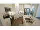 Corner view of kitchen area with a kitchen island, stainless steel appliances and granite countertops at 1009 Morrison Dr, Durham, NC 27703