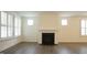 Bright living room with modern fireplace and wooden floors at 1009 Morrison Dr, Durham, NC 27703