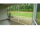 Relaxing screened porch with view of the lush green backyard and natural landscape at 1009 Morrison Dr, Durham, NC 27703