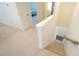Carpeted staircase leading to lower level with bedroom and bonus room at 1009 Morrison Dr, Durham, NC 27703