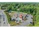 Aerial view showcases the property's proximity to a large parking area, playground, and other neighborhood amenities at 1013 New Chester Ct, Apex, NC 27502