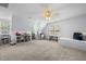 Spacious bonus room with great natural light, ceiling fan, shelving and trundle bed perfect for playroom or bedroom at 1013 New Chester Ct, Apex, NC 27502