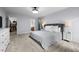 Open bedroom with a large bed, ensuite bathroom, and spacious walk-in closet at 1013 New Chester Ct, Apex, NC 27502