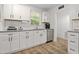 Bright kitchen features granite countertops, subway tile backsplash, and stainless appliances at 1014 E Club Blvd, Durham, NC 27704