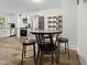 Bright eat-in kitchen with stainless appliances and modern white cabinetry at 1014 E Club Blvd, Durham, NC 27704