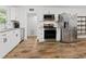 Spacious kitchen featuring stainless steel appliances and wood-look vinyl flooring at 1014 E Club Blvd, Durham, NC 27704