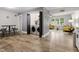 Laundry area with washer and dryer, storage, table with chairs, and wood flooring at 1014 E Club Blvd, Durham, NC 27704