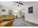 Cozy living room featuring modern decor, wood floors, natural light, and comfortable seating at 1014 E Club Blvd, Durham, NC 27704