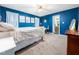 Inviting primary bedroom featuring a comfortable bed, soft lighting, and access to an ensuite bathroom at 102 Heritage Ridge Ct, Knightdale, NC 27545
