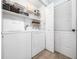 Functional laundry room with modern appliances, ample storage, and efficient layout for convenient chores at 102 Heritage Ridge Ct, Knightdale, NC 27545