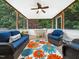 Cozy sunroom featuring comfortable seating, a colorful rug, and plenty of natural light for relaxation at 102 Heritage Ridge Ct, Knightdale, NC 27545