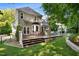 The home features a charming, multi-level wooden deck that offers ample space for outdoor entertaining at 1025 Kingsway Dr, Apex, NC 27502