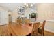 A separate dining area flows into the living room with a hardwood table and seating for four at 1025 Kingsway Dr, Apex, NC 27502
