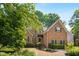 Beautiful brick home featuring manicured landscaping and a welcoming entrance at 1025 Kingsway Dr, Apex, NC 27502