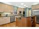 Stylish kitchen showcasing custom cabinetry, granite countertops, and modern stainless appliances at 1025 Kingsway Dr, Apex, NC 27502