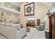 Spacious living room with high ceilings, a cozy couch, and a star quilt on the wall at 1025 Kingsway Dr, Apex, NC 27502