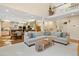 An open-concept living room with high ceilings connects to the adjacent kitchen and dining area at 1025 Kingsway Dr, Apex, NC 27502