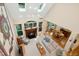 Bright living space featuring high ceilings, a fireplace, and an adjoining dining area at 1025 Kingsway Dr, Apex, NC 27502