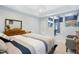A well-lit main bedroom suite connects to a bathroom with a step-in shower and a soaking tub at 1025 Kingsway Dr, Apex, NC 27502