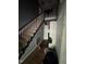Hallway featuring hardwood floors, staircase, and natural light at 1036 Altice Dr, Raleigh, NC 27603