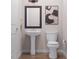 Half bathroom featuring pedestal sink and minimalist decor at 1038 Zelkova Ln, Chapel Hill, NC 27517