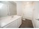 Bright bathroom features a modern vanity with wood look floors and a shower-tub combo at 105 Ambergate Ct, Rocky Mount, NC 27804