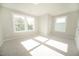 Bright bedroom featuring carpeted floors, two large windows, and neutral paint at 105 Ambergate Ct, Rocky Mount, NC 27804