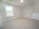 Bright bedroom with neutral carpet, a window, and a closet at 105 Ambergate Ct, Rocky Mount, NC 27804