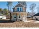 Charming two-story home with a welcoming front porch and neutral-toned siding at 105 Ambergate Ct, Rocky Mount, NC 27804