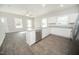 Modern kitchen with white cabinets, stainless steel appliances, and a center island at 105 Ambergate Ct, Rocky Mount, NC 27804
