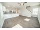 Open-concept living space with wood floors, and kitchen with stainless steel appliances at 105 Ambergate Ct, Rocky Mount, NC 27804